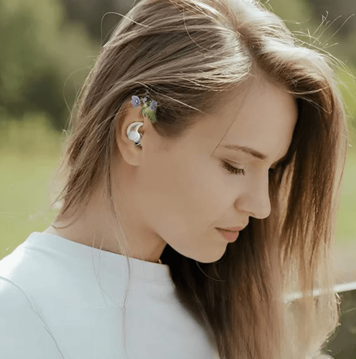 Ear plug on blonde women